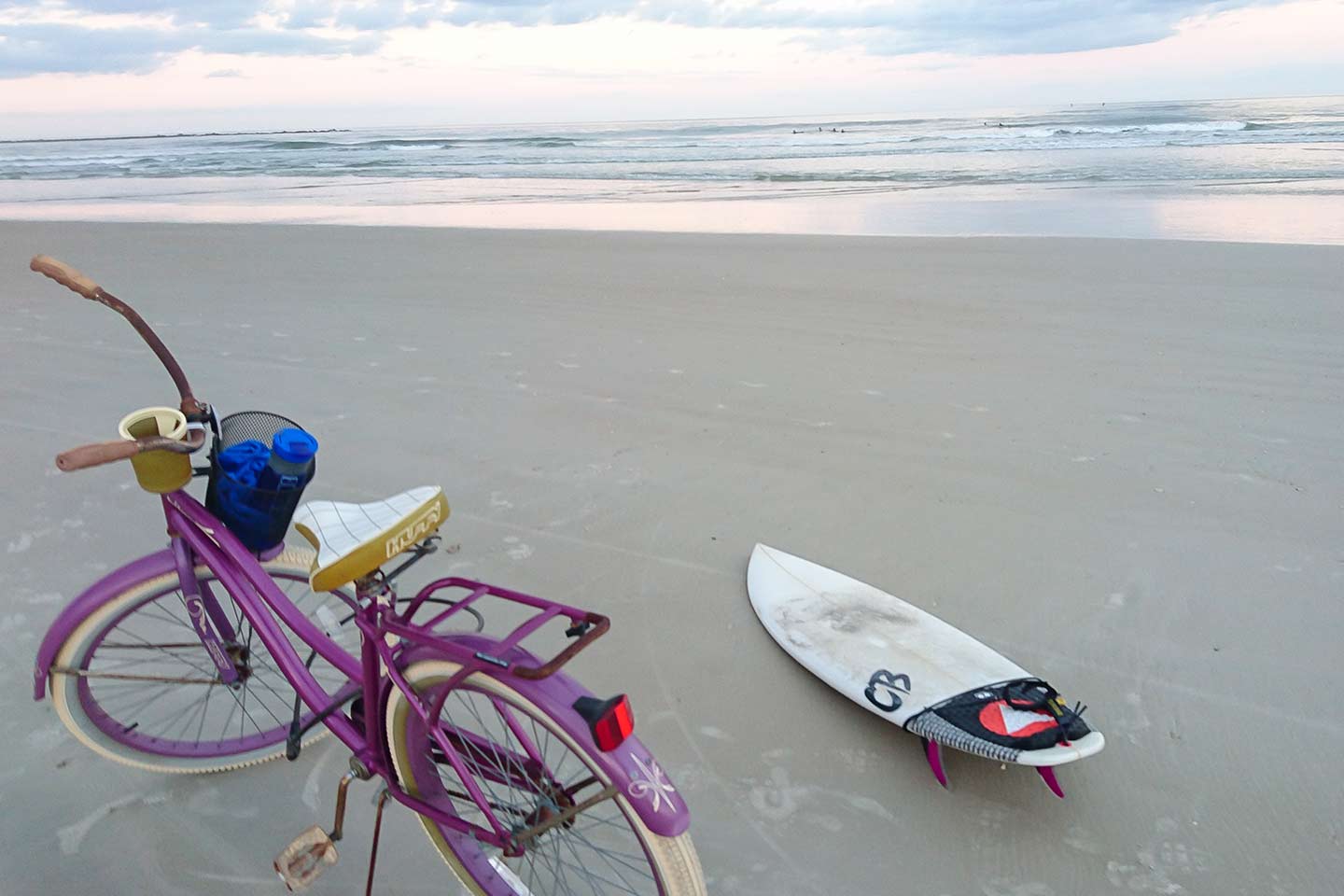 Purple Bike and Surf Board on the Beach